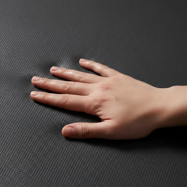 Close-up of Artuga Power Grip Mat's PU surface, showing moisture-activated grip and texture.