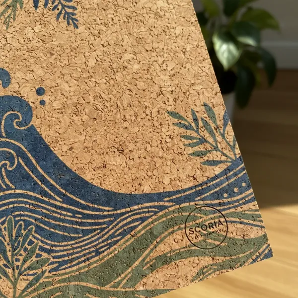 A close-up shot of a Scoria cork yoga mat showcasing its natural texture and design.