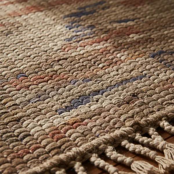 A thick, handwoven traditional Mysore yoga rug with intricate patterns, showcasing authentic Indian craftsmanship.
