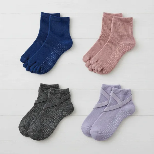 Assortment of grip sock styles: full-toe, toeless, ankle, and ballet, displayed for fitness.