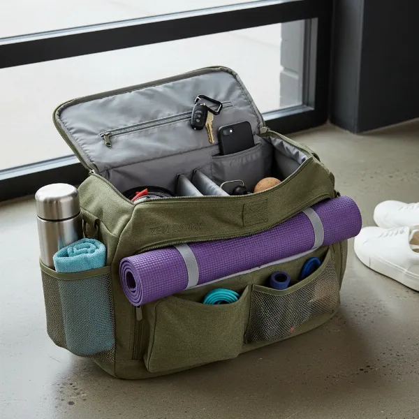 Yoga mat bag open, revealing organized compartments for mat, water bottle, towel, and phone.